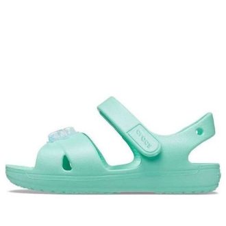 Crocs (GS) Classic Cross-Strap Charm Sandalen «Türkis» 206947-3U3